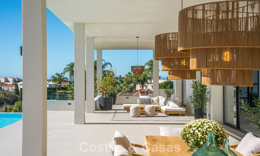 Exclusieve designvilla met panoramisch zeezicht te koop in het een vijfsterren golfresort in Marbella - Benahavis 74792